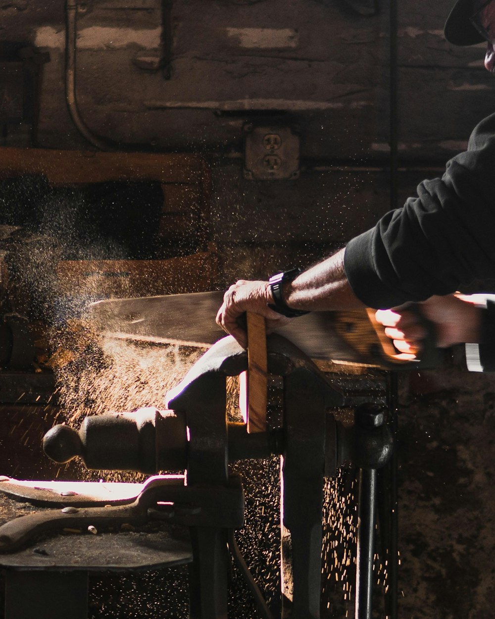 A JR Designs craftsman shaping solid wood by hand in the Phoenix atelier
